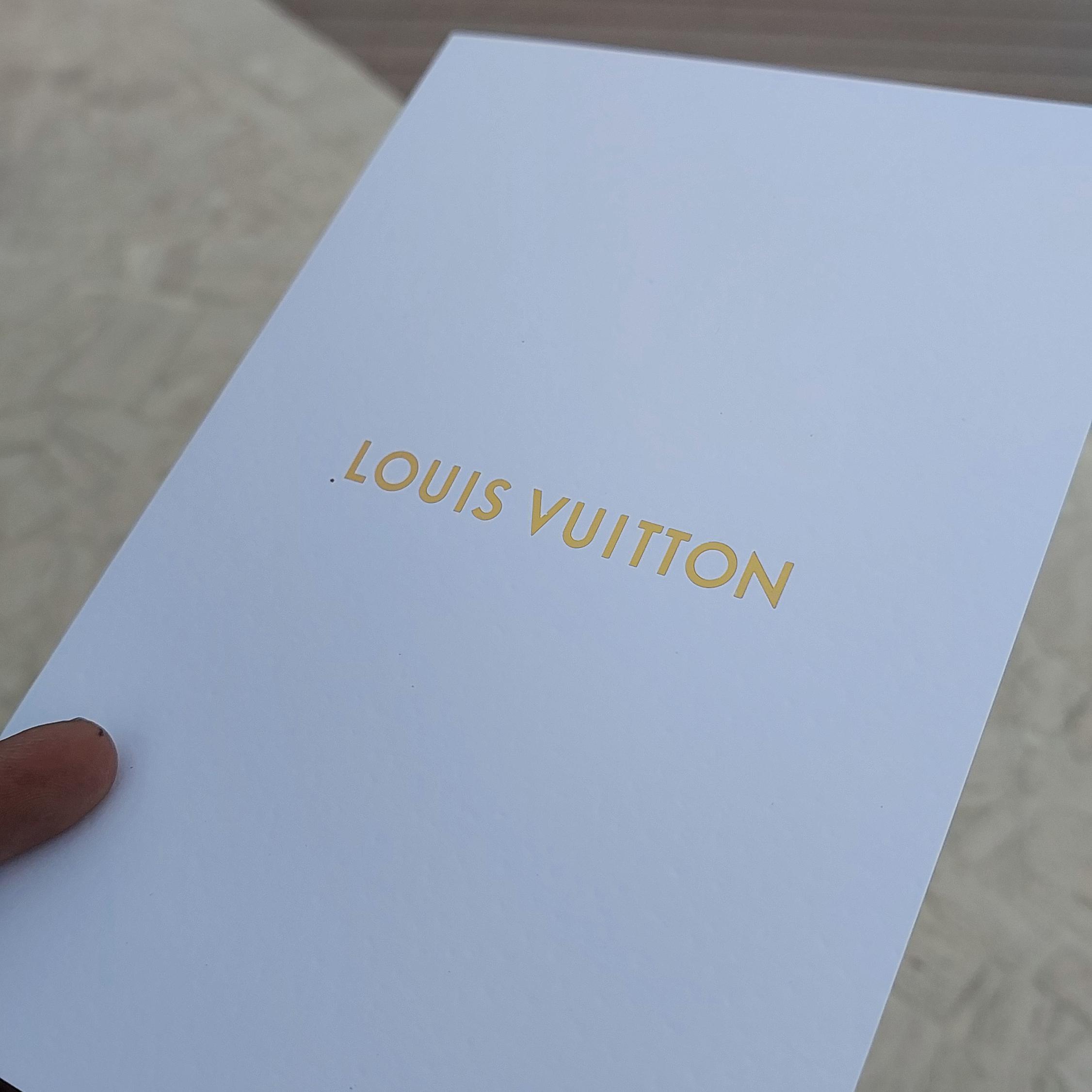 Guest using Text Selfie Photo Booth at an event in Dubai, receiving a printed word cloud image made from their photo with custom branded text for marketing activation